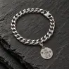 Bracciale a maglia in acciaio con ciondolo